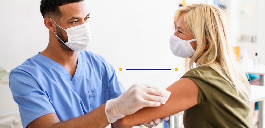imagem de um homem e uma mulher, sendo um enfermeiro e um paciente, simbolização do dia mundial da imunização.